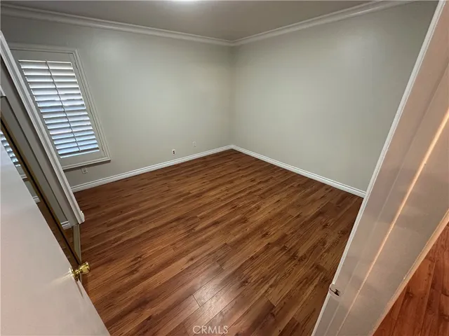 a view of wooden floor with staircase