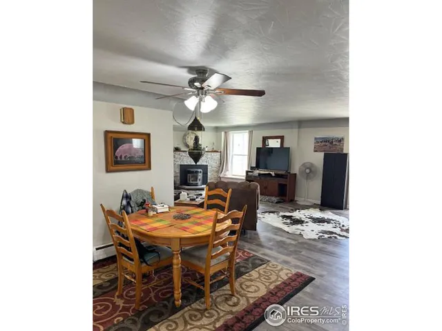 a outdoor dining space with furniture and a chandelier
