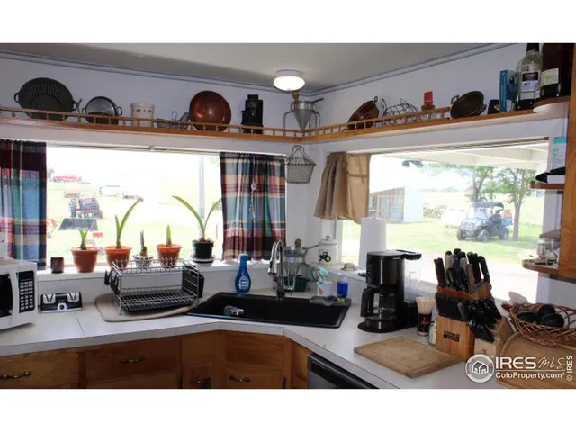 a view of living room filled with furniture and floor to ceiling window