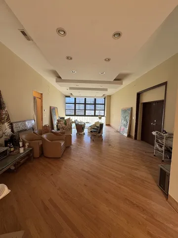 a bedroom with a bed and a lamp