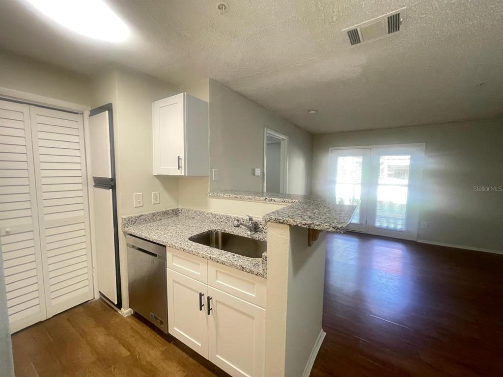238 Afton Square, Unit 106 Altamonte Springs, FL 32714 - Photo 11 of 33 a kitchen with a stove and a sink