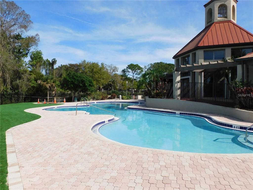 238 Afton Square, Unit 106 Altamonte Springs, FL 32714 - Photo 24 of 33 a view of swimming pool with lawn chairs and plants