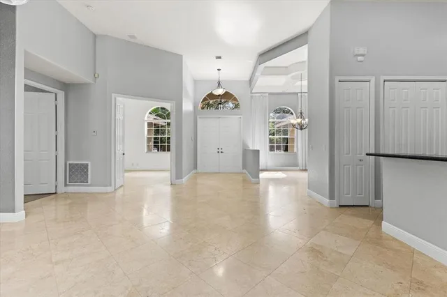 a view of a hallway with bathroom