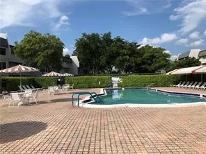 a view of a park with large trees