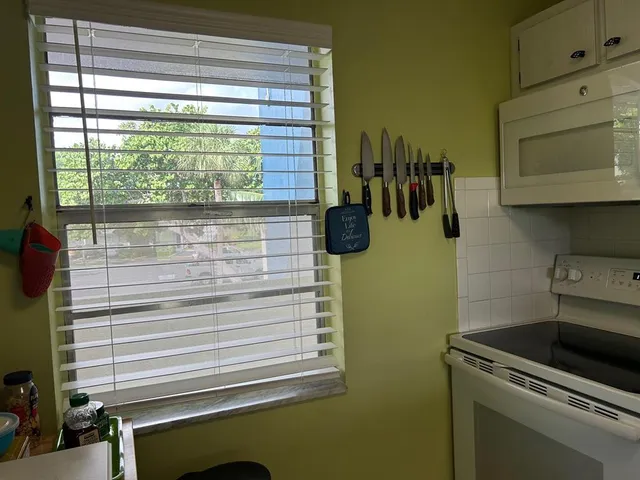 a view of storage and utility room with washer and dryer