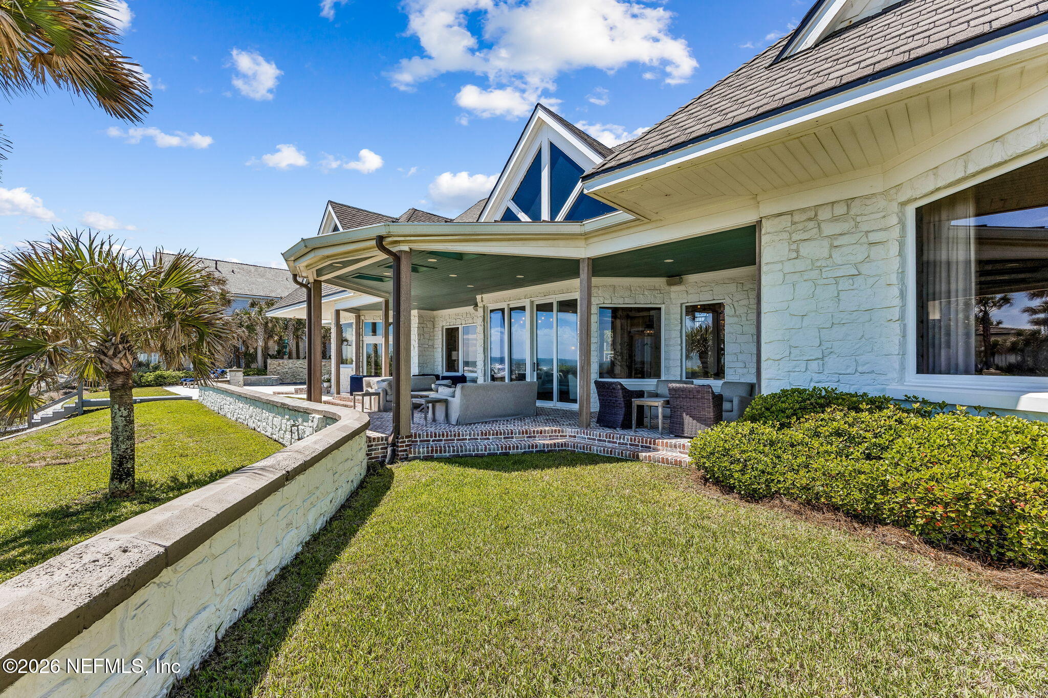 4 Ocean Ridge Court Ponte Vedra Beach, FL 32082 - Photo 109 of 132 a view of a patio with swimming pool table and chairs