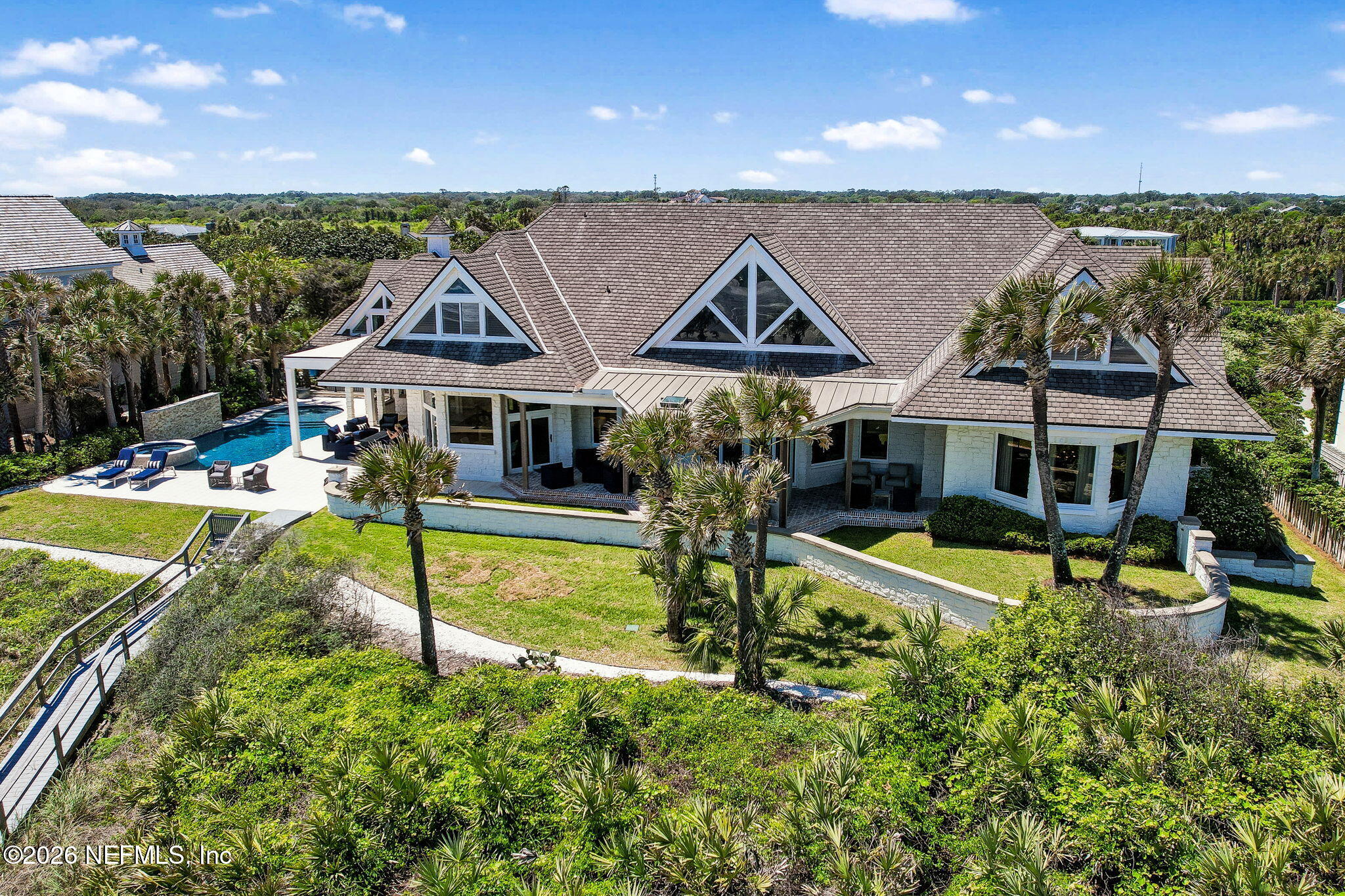 4 Ocean Ridge Court Ponte Vedra Beach, FL 32082 - Photo 117 of 132 an aerial view of a house with swimming pool and a yard