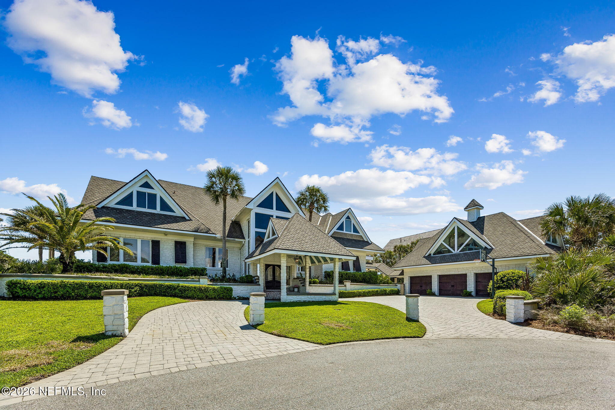 4 Ocean Ridge Court Ponte Vedra Beach, FL 32082 - Photo 118 of 132 a front view of a house with a yard and potted plants