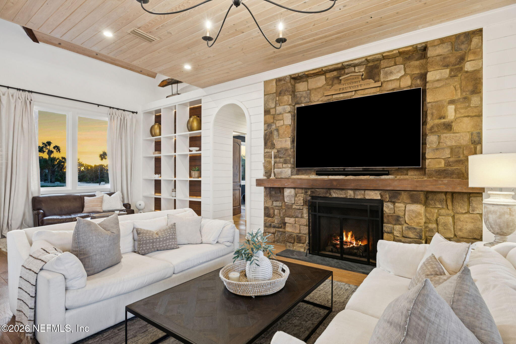 4 Ocean Ridge Court Ponte Vedra Beach, FL 32082 - Photo 120 of 132 a living room with furniture a fireplace and a flat screen tv