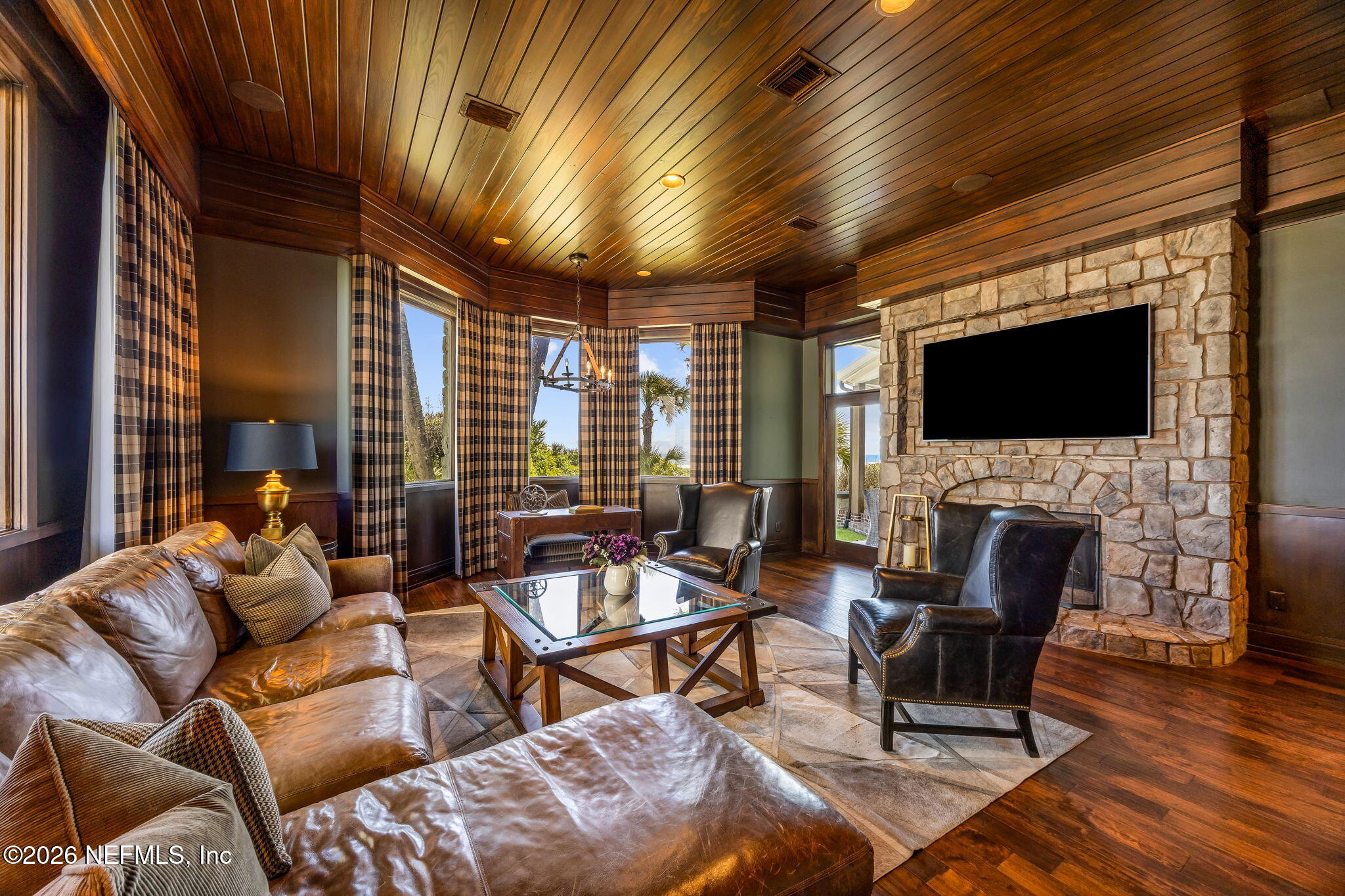 4 Ocean Ridge Court Ponte Vedra Beach, FL 32082 - Photo 39 of 132 a living room with furniture a flat screen tv and a fireplace