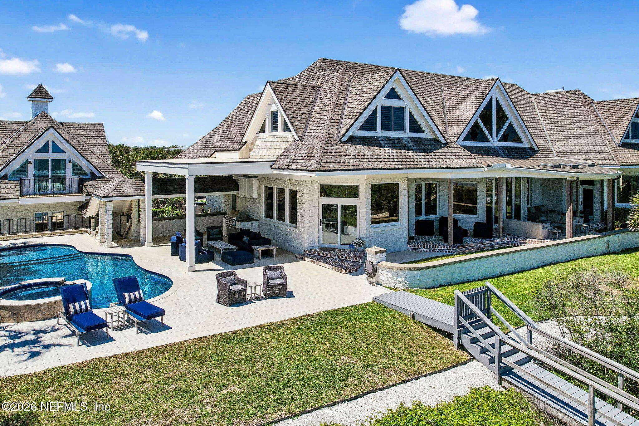 4 Ocean Ridge Court Ponte Vedra Beach, FL 32082 - Photo 9 of 132 a view of a house with swimming pool and furniture