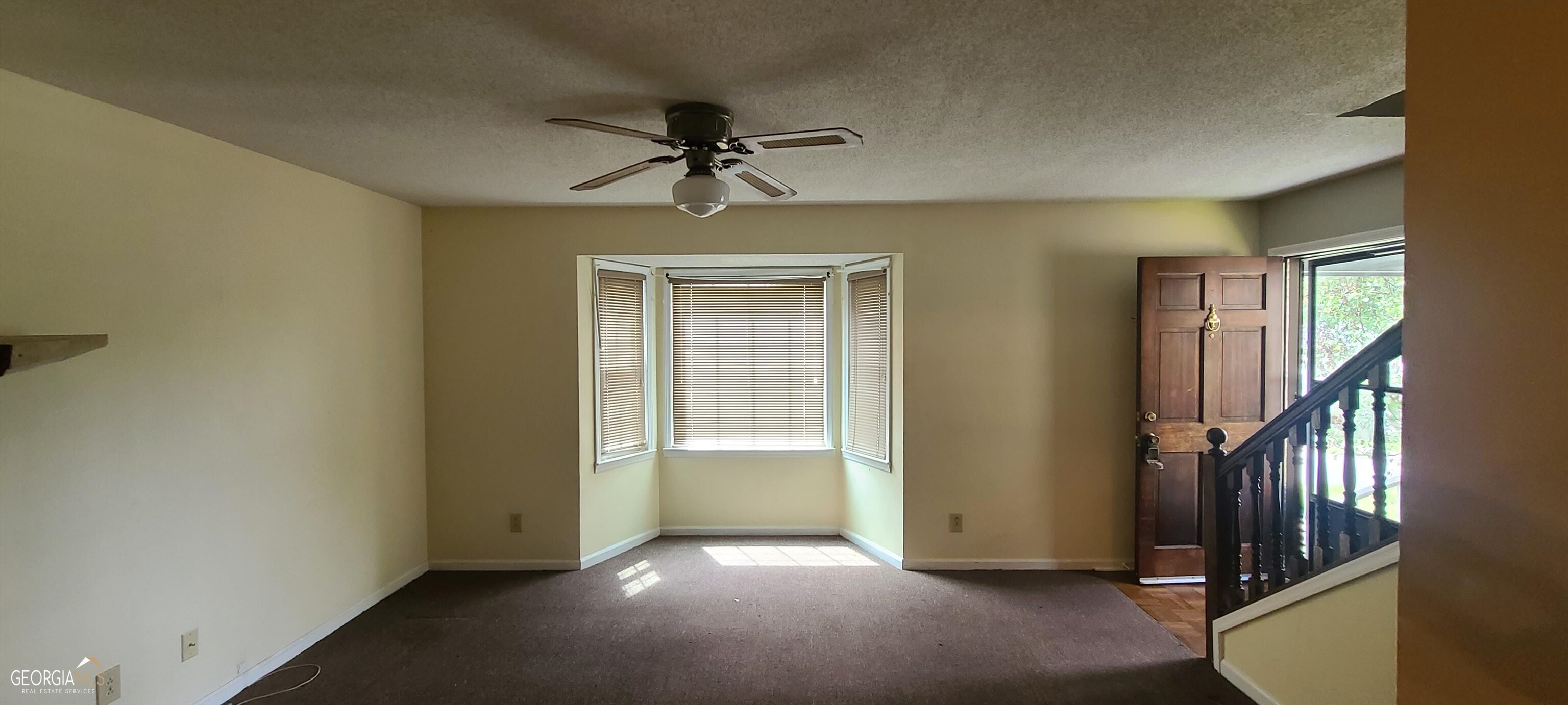 4353 Barrington Place Macon, GA 31210 - Photo 4 of 12 a view of a livingroom with a ceiling fan and window