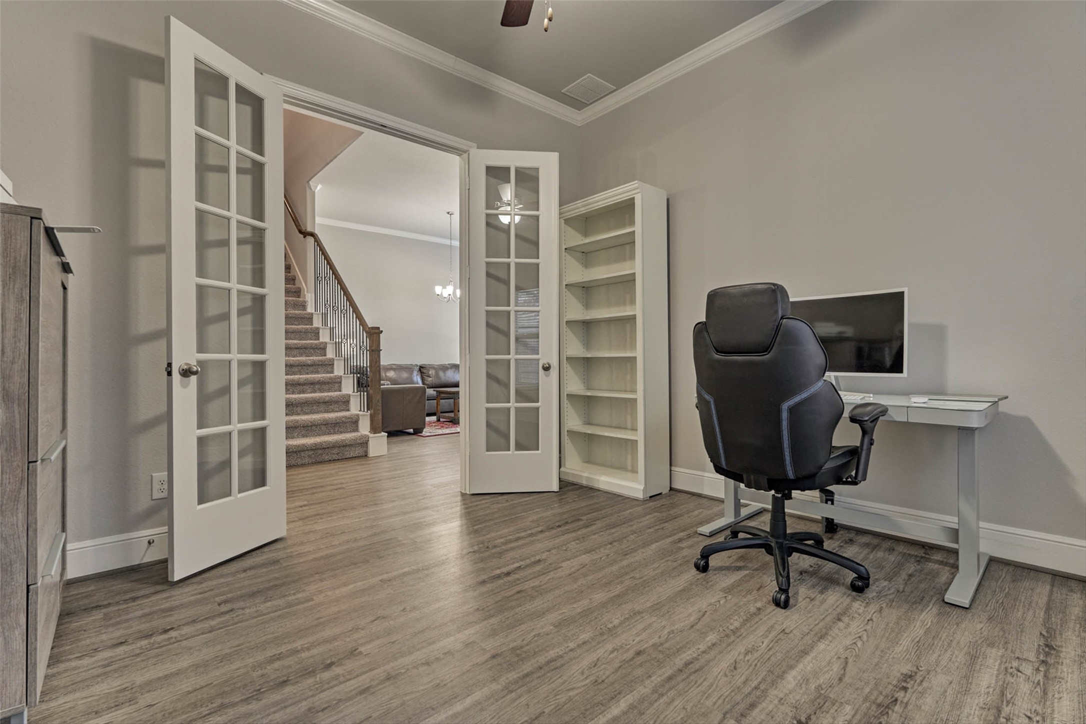 10660 Red Tail Place Conroe, TX 77385 - Photo 27 of 50 a view of a workspace with wooden floor and windows
