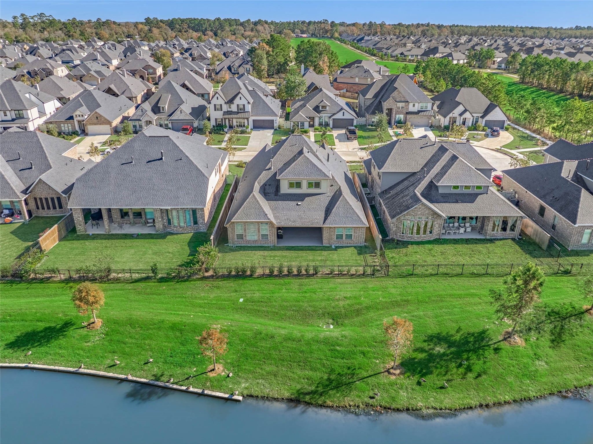 10660 Red Tail Place Conroe, TX 77385 - Photo 3 of 50 a view of an house with backyard space and garden