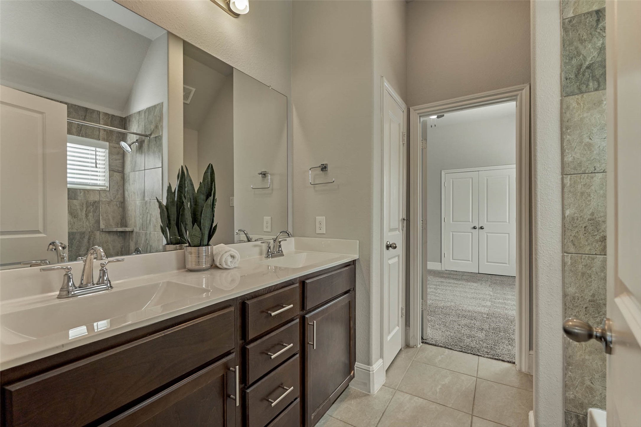 10660 Red Tail Place Conroe, TX 77385 - Photo 32 of 50 a bathroom with a granite countertop sink a toilet and shower