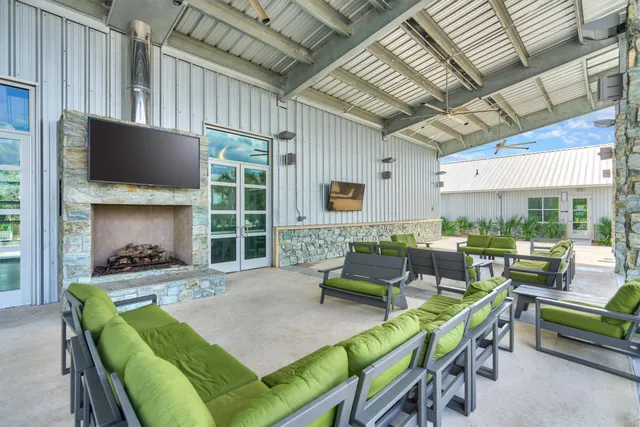 an aerial view of a house with outdoor space