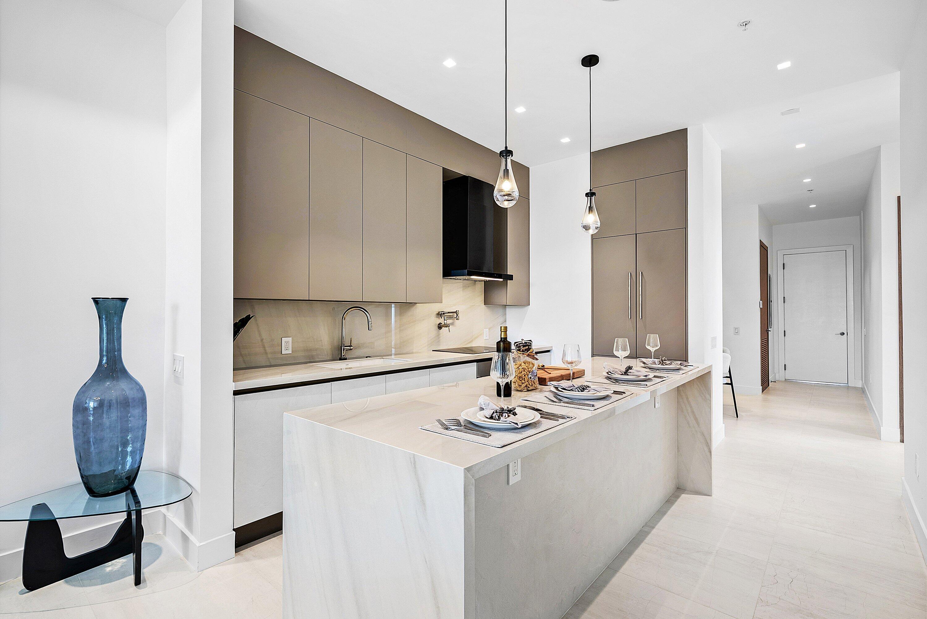 246 Northeast 6th Avenue, Unit 3B Delray Beach, FL 33483 - Photo 5 of 23 a bathroom with a double vanity sink a mirror and shower