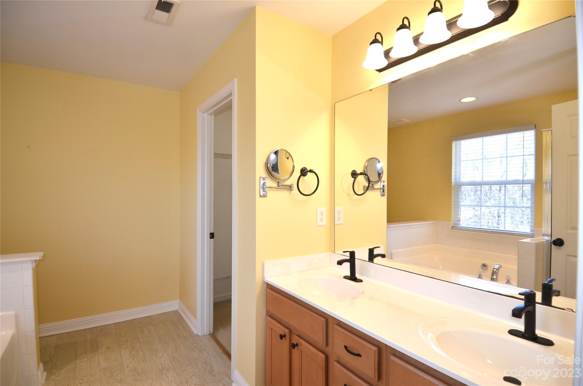743 Prospect Lane Fort Mill, SC 29708 - Photo 11 of 24 a bathroom with a sink a tub and a shower