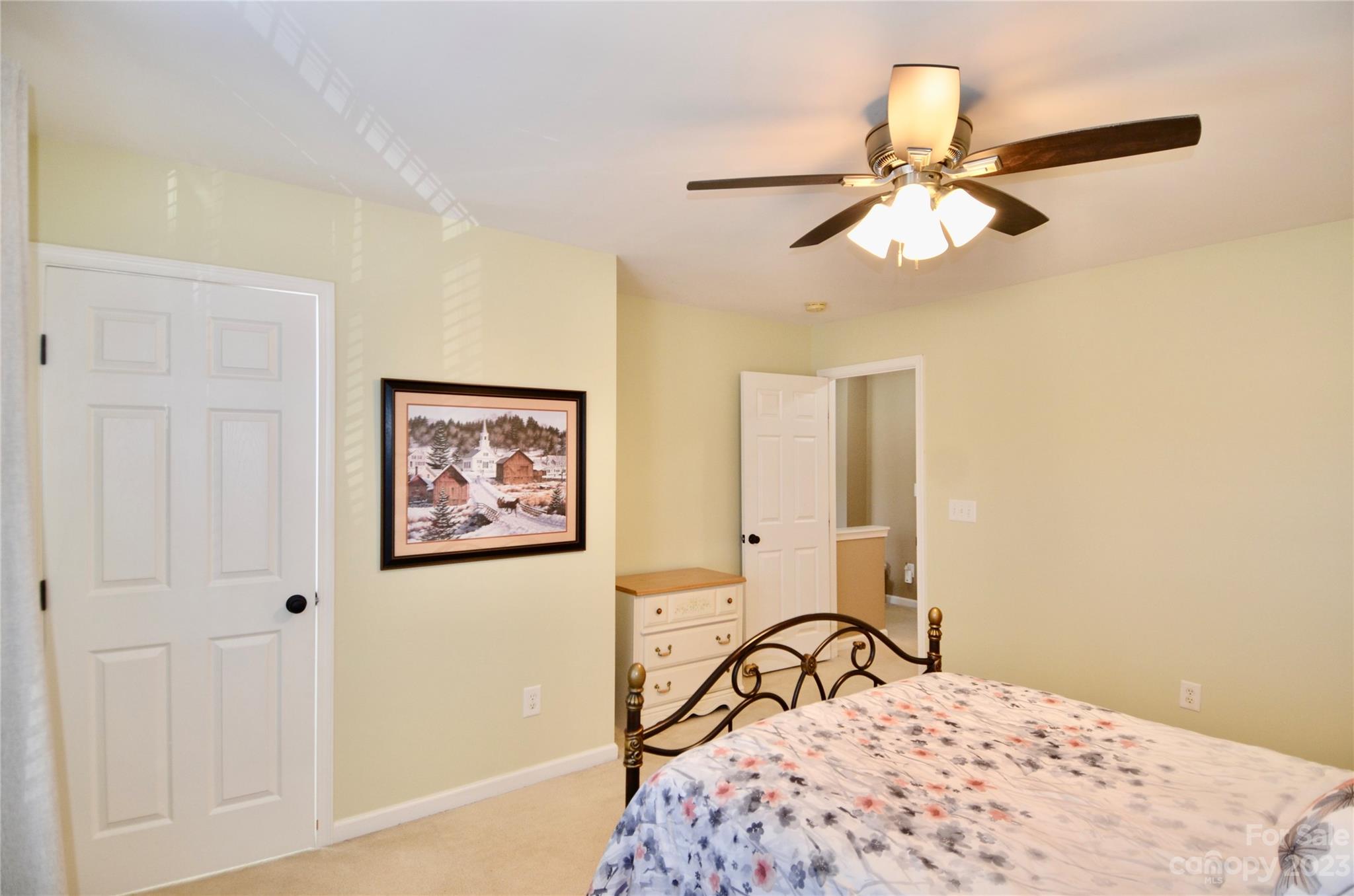 743 Prospect Lane Fort Mill, SC 29708 - Photo 15 of 24 a bedroom with a bed and a chandelier