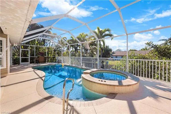 a view of a swimming pool with a patio