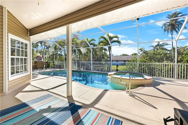 a view of swimming pool with a lounge chair