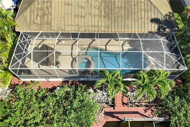 a view of a chairs and table in the balcony
