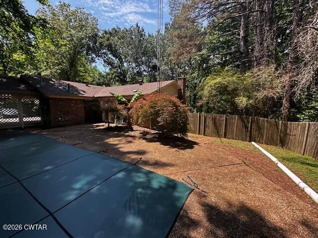 1400 Roper Road Bolivar, TN 38008 - Photo 22 of 23 a backyard of a house with table and chairs