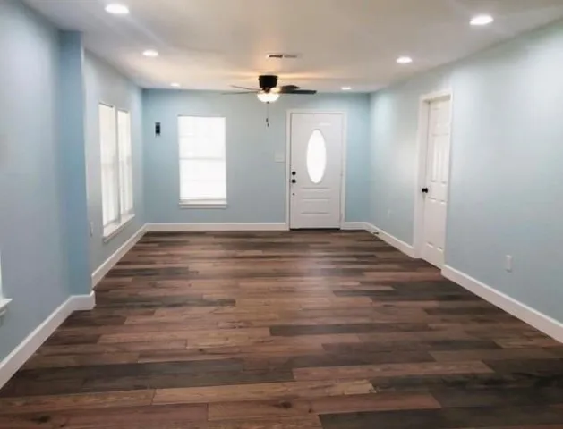 a view of an empty room and window