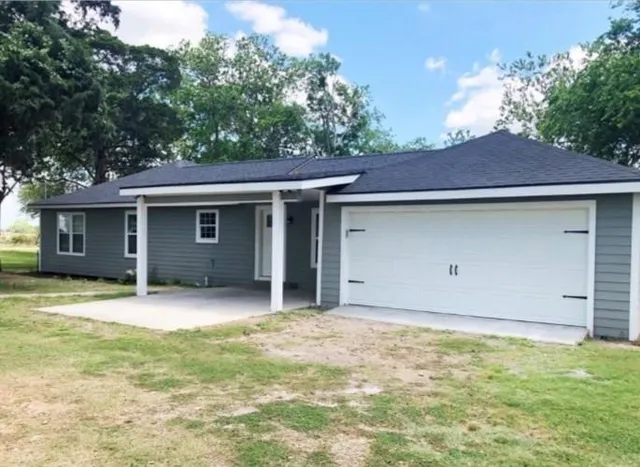 a house with yard in front of it