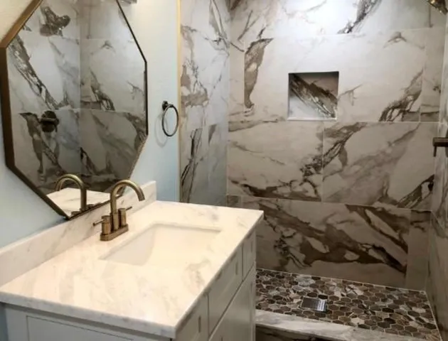 a bathroom with a sink and mirror