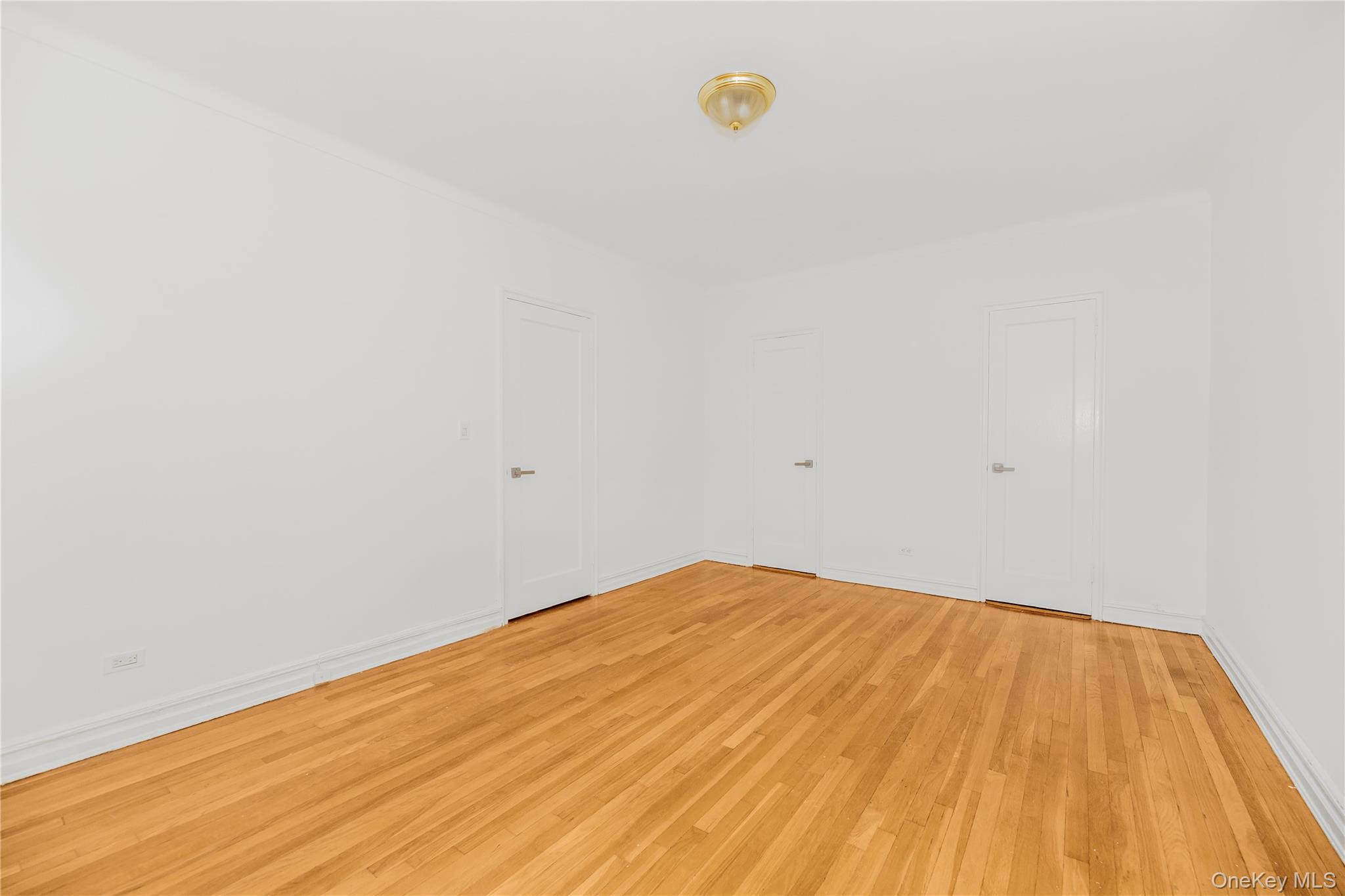 766 Palmer Road, Unit 2D Bronxville, NY 10708 - Photo 11 of 21 a view of empty room with wooden floor