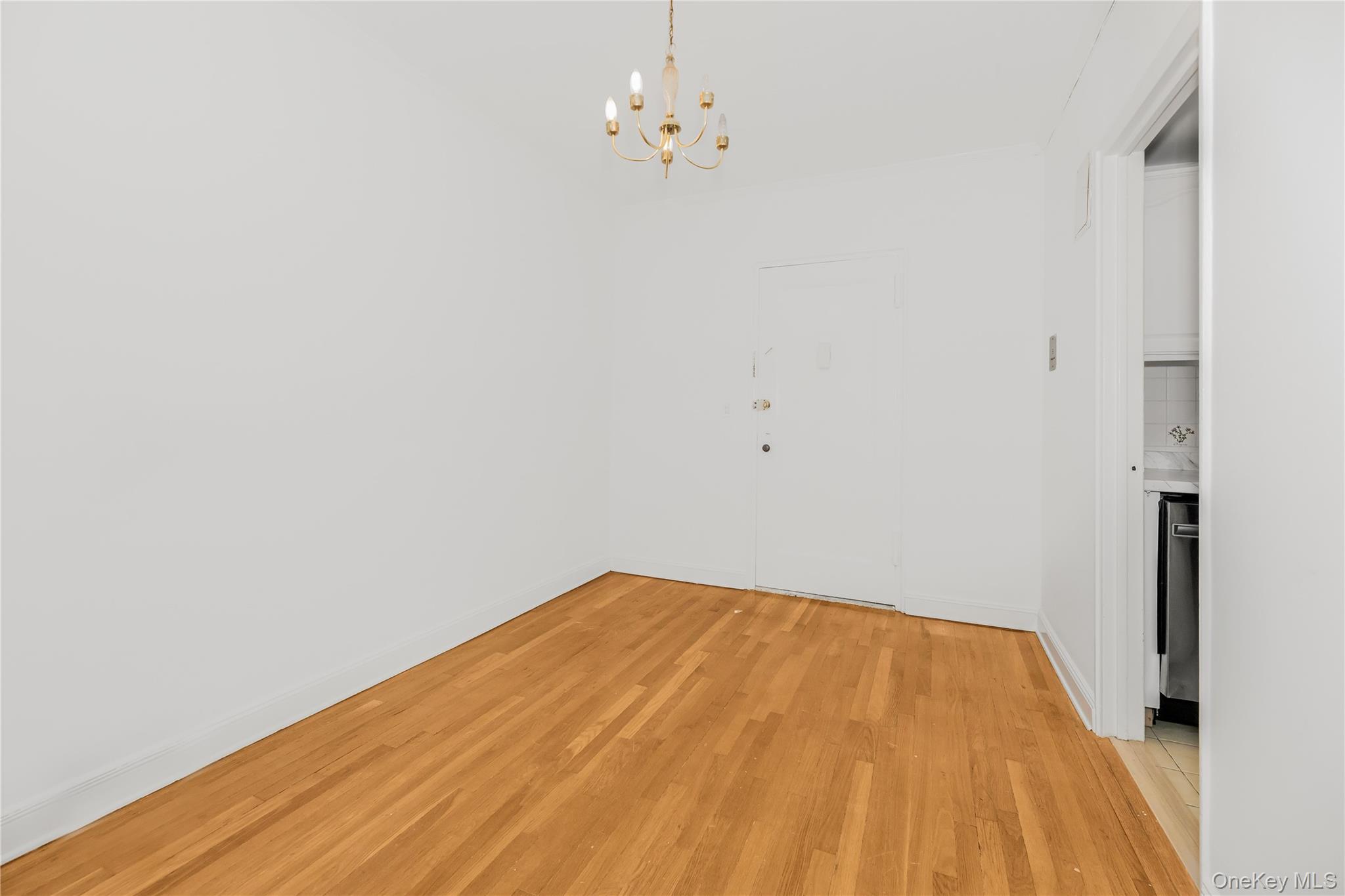 766 Palmer Road, Unit 2D Bronxville, NY 10708 - Photo 12 of 21 a view of empty room with wooden floor
