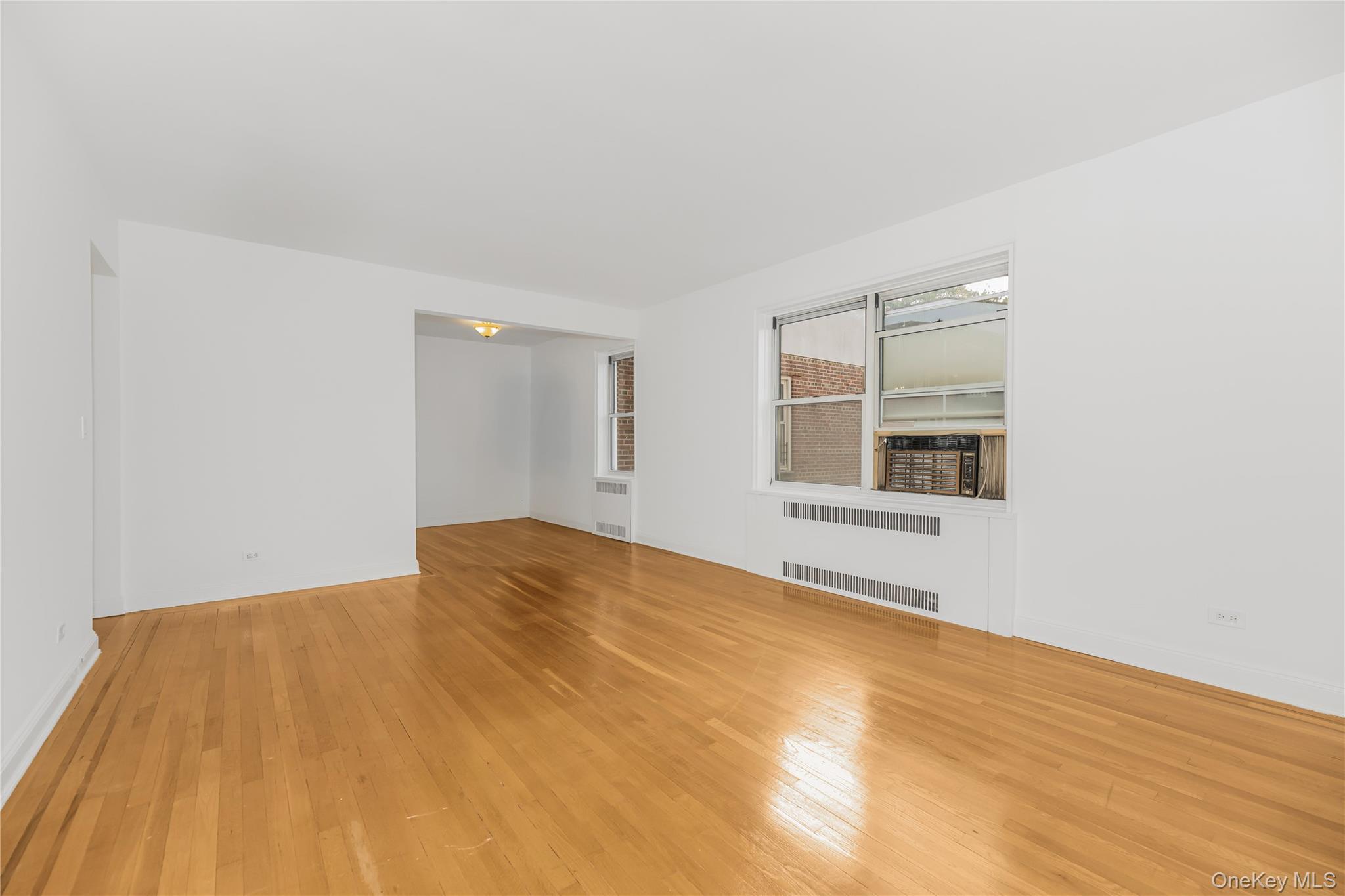 766 Palmer Road, Unit 2D Bronxville, NY 10708 - Photo 15 of 21 a view of empty room with wooden floor and fan