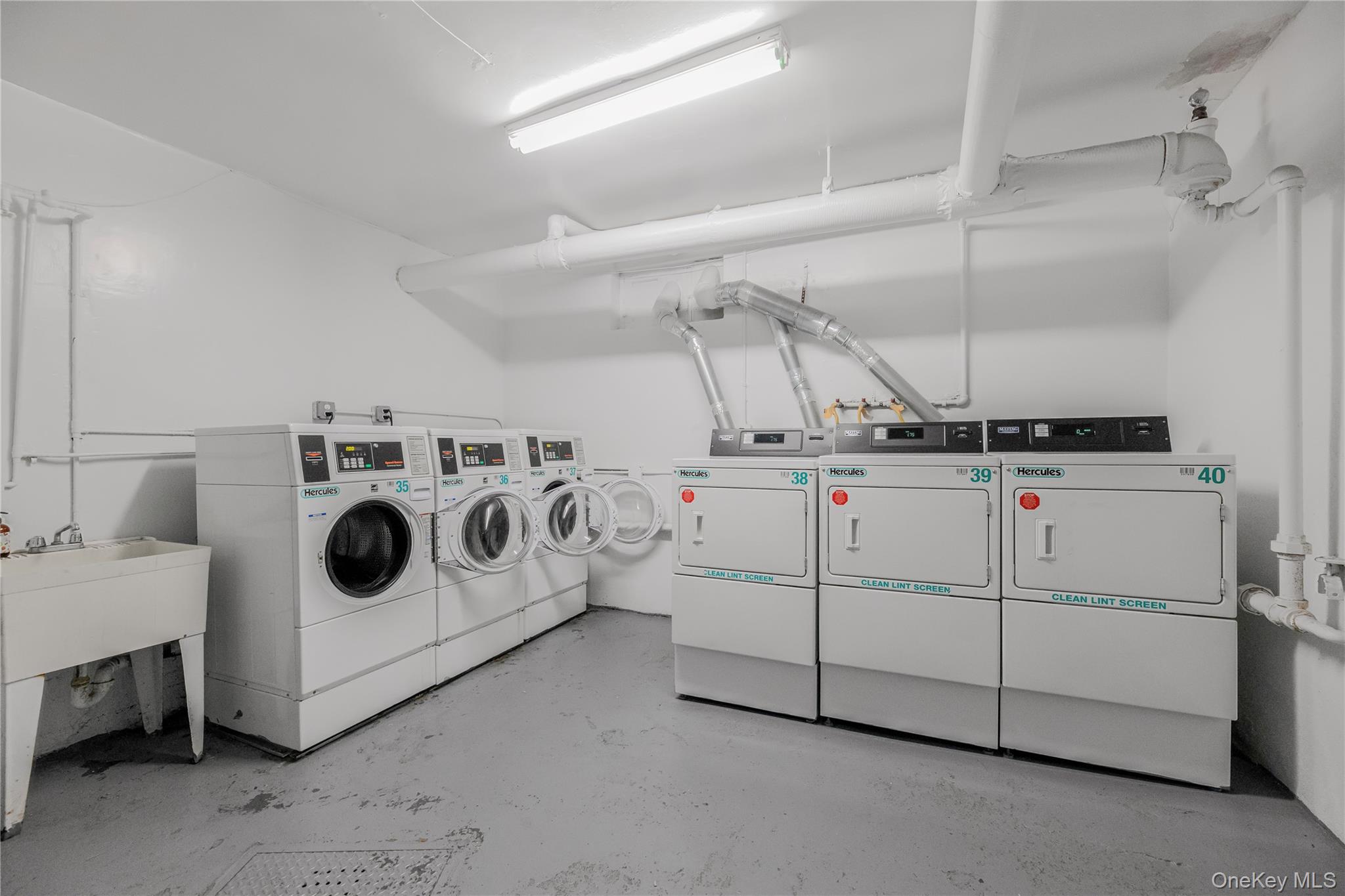 766 Palmer Road, Unit 2D Bronxville, NY 10708 - Photo 17 of 21 a utility room with dryer and washer
