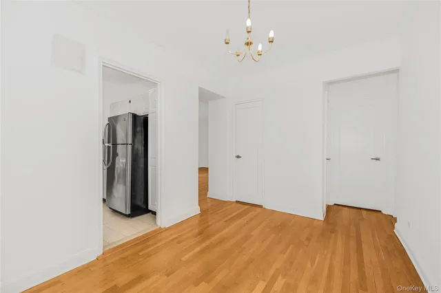 a picture of a bench in front of a wall