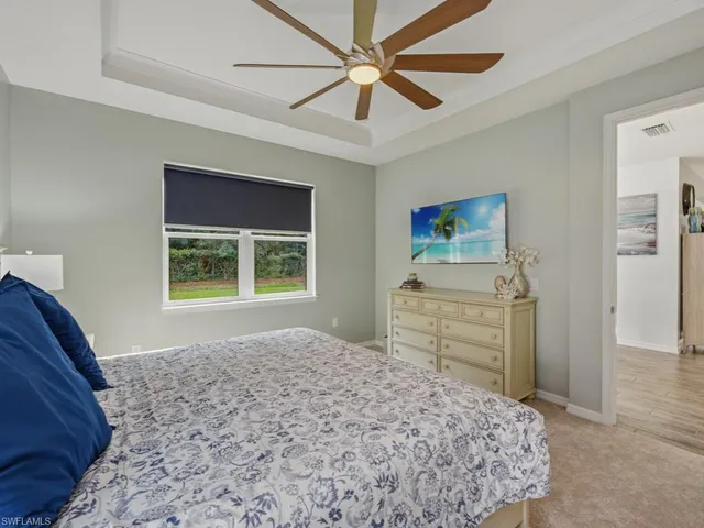 a bedroom with a bed and a dresser