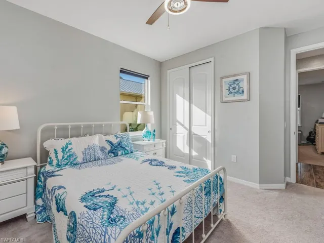 a bedroom with a bed and a table