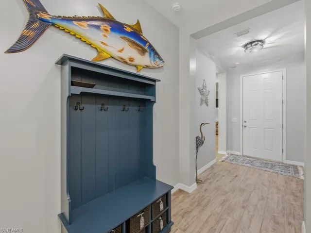a view of a hallway with entryway door