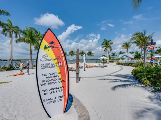 a view of swimming pool with sitting area