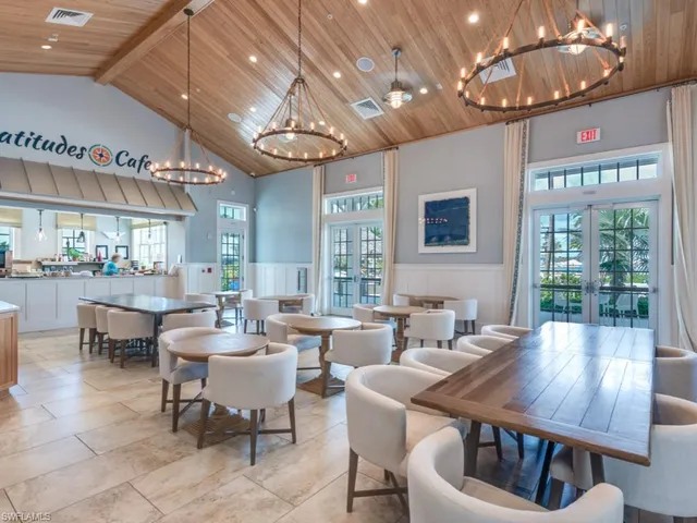 a lobby with furniture and a large window