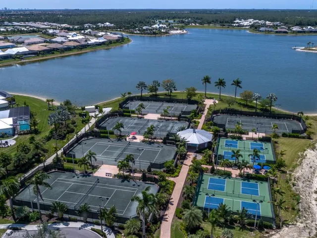 an aerial view of a house with a lake view