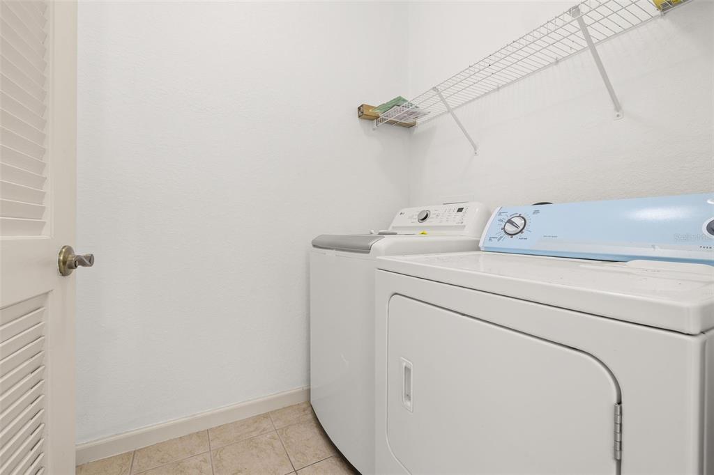 3025 Greystone Loop, Unit 204 Kissimmee, FL 34741 - Photo 16 of 37 a utility room with dryer and washer
