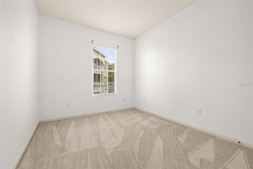 3025 Greystone Loop, Unit 204 Kissimmee, FL 34741 - Photo 17 of 37 an empty room with windows