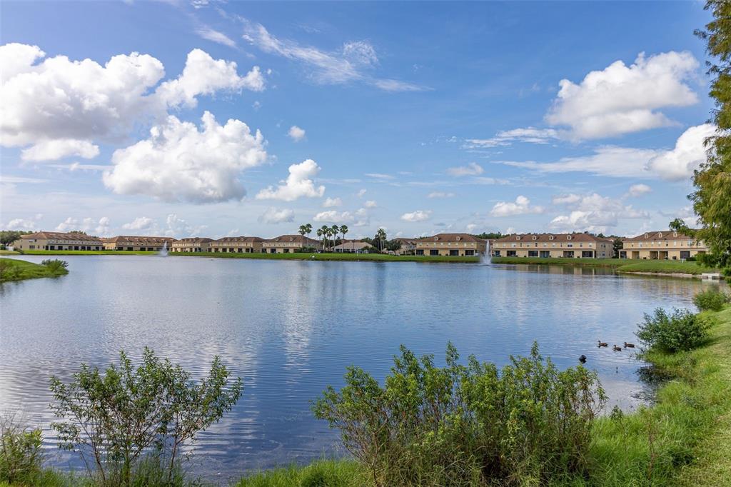 3025 Greystone Loop, Unit 204 Kissimmee, FL 34741 - Photo 34 of 37 a view of a lake with a city