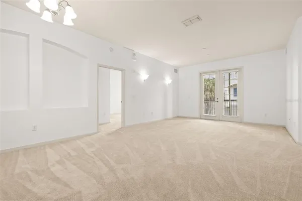 a view of an empty room with a window