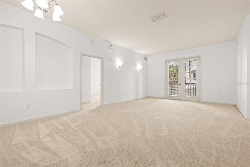 3025 Greystone Loop, Unit 204 Kissimmee, FL 34741 - Photo 4 of 37 a view of an empty room with a window