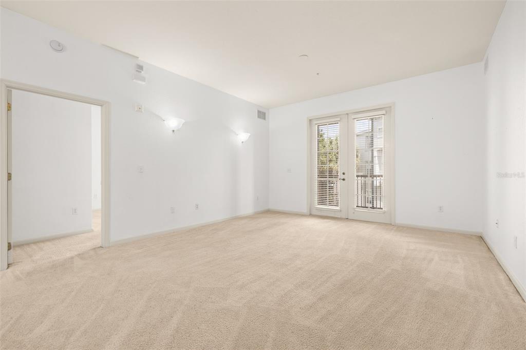 3025 Greystone Loop, Unit 204 Kissimmee, FL 34741 - Photo 7 of 37 an empty room with windows