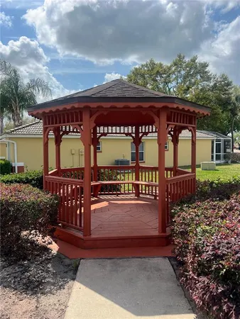 a view of a chairs and table in the patio