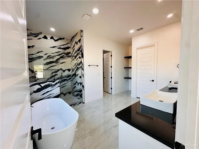 a view of a room with gym equipment and a large window