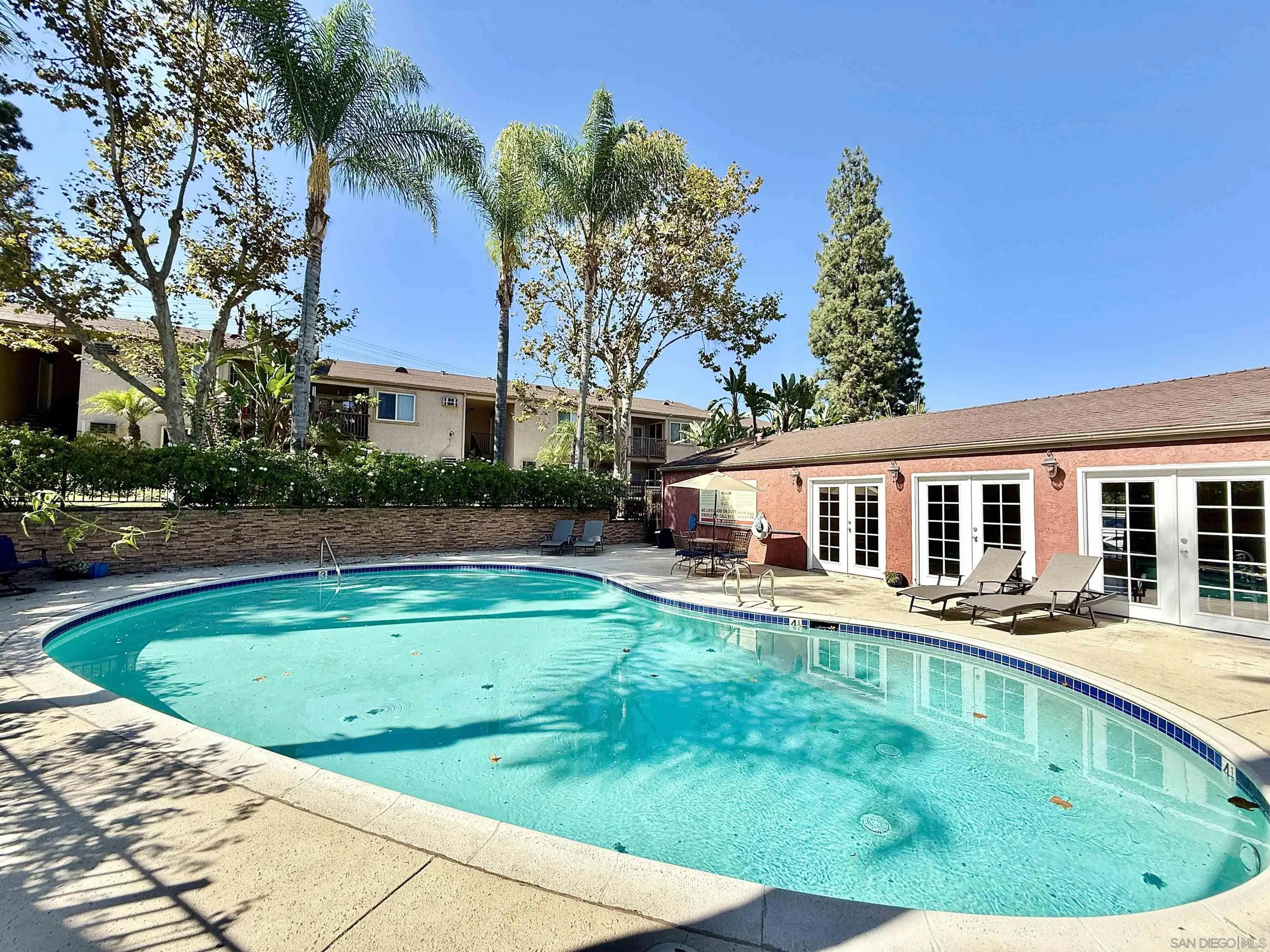 1280 West Main Street, Unit 3 El Cajon, CA 92020 - Photo 23 of 29 a view of a house with a swimming pool